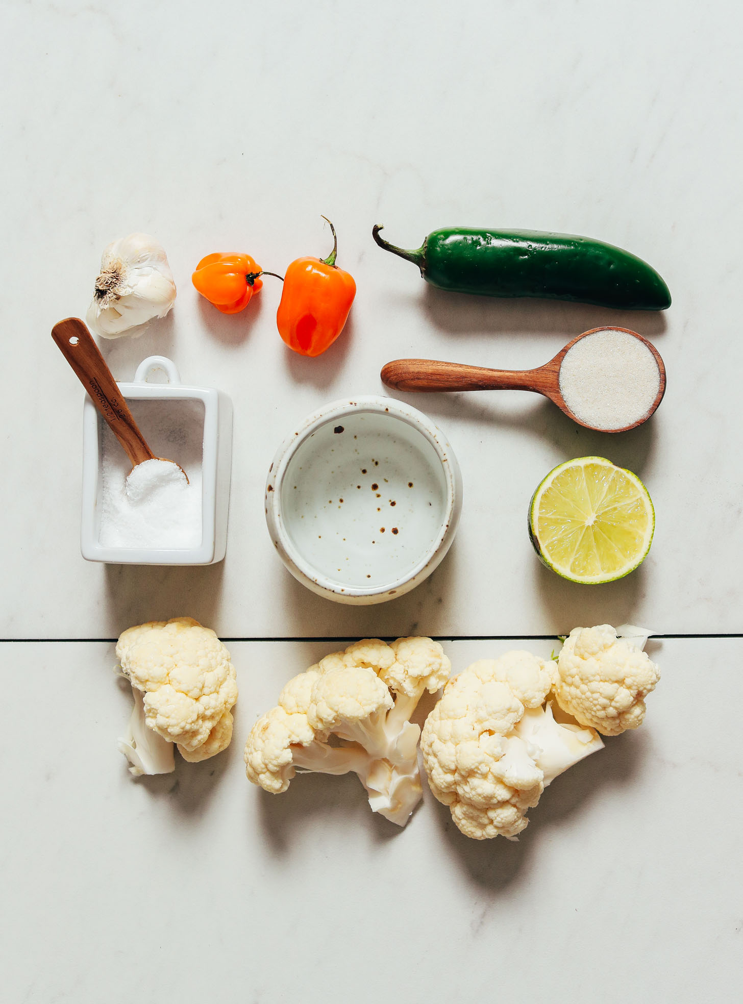 Cauliflower, habanero, jalapeno, lime, and other ingredients for making our easy Escabeche recipe