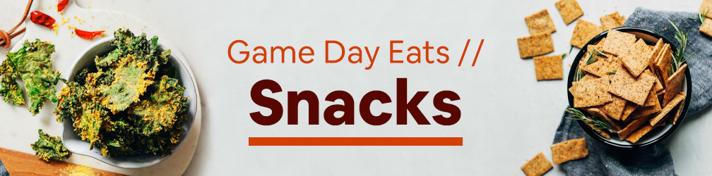 Bowls of kale chips and gluten-free crackers for our round-up of super bowl snack recipes