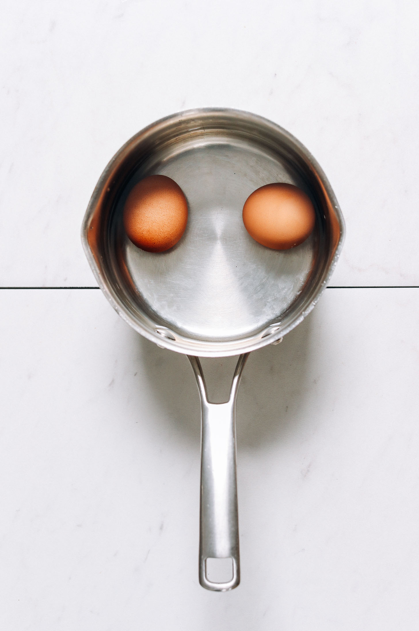 Eggs in a saucepan for our tutorial on how to make hard boiled eggs