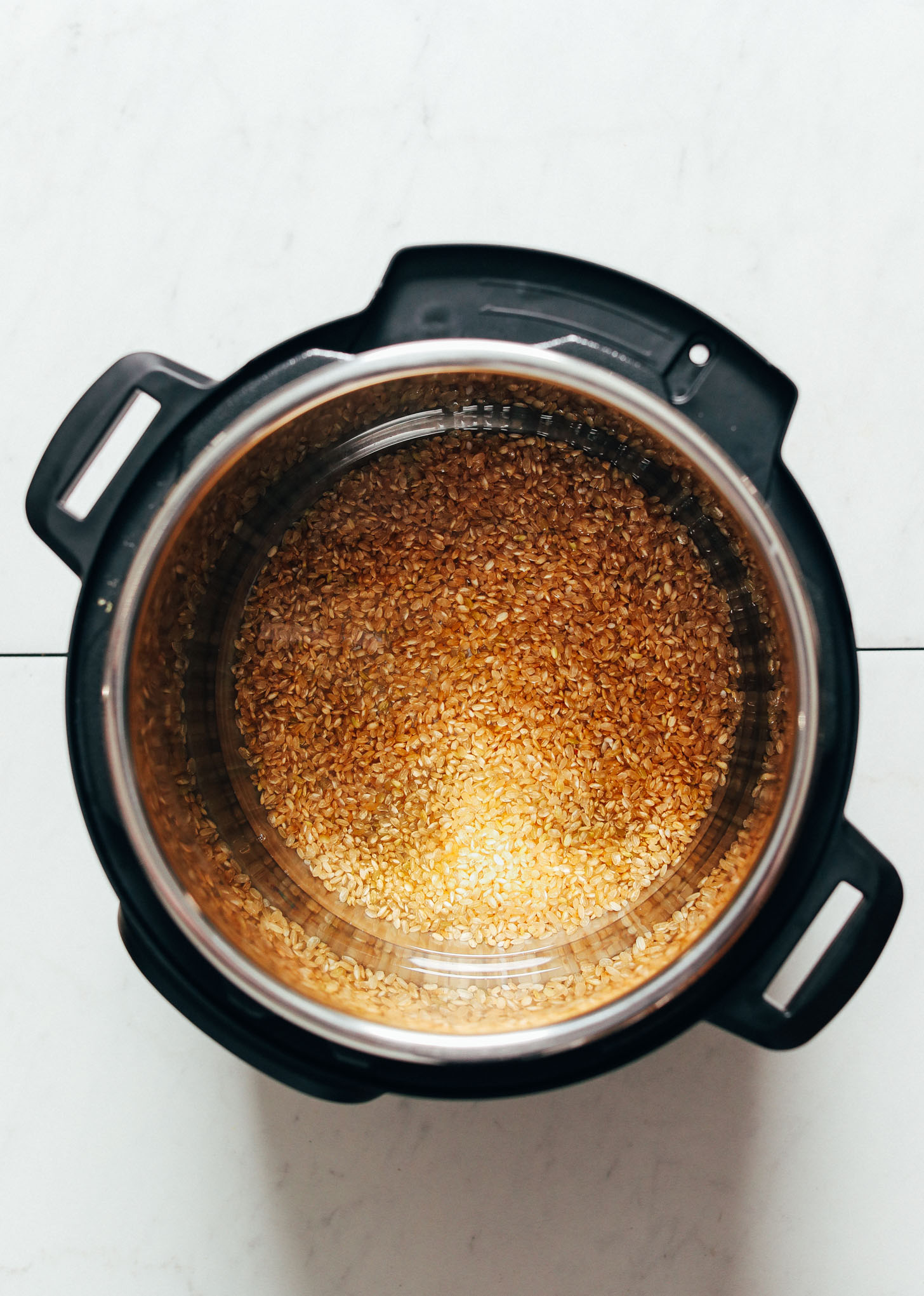 Showing the first step for how to cook Instant Pot brown rice