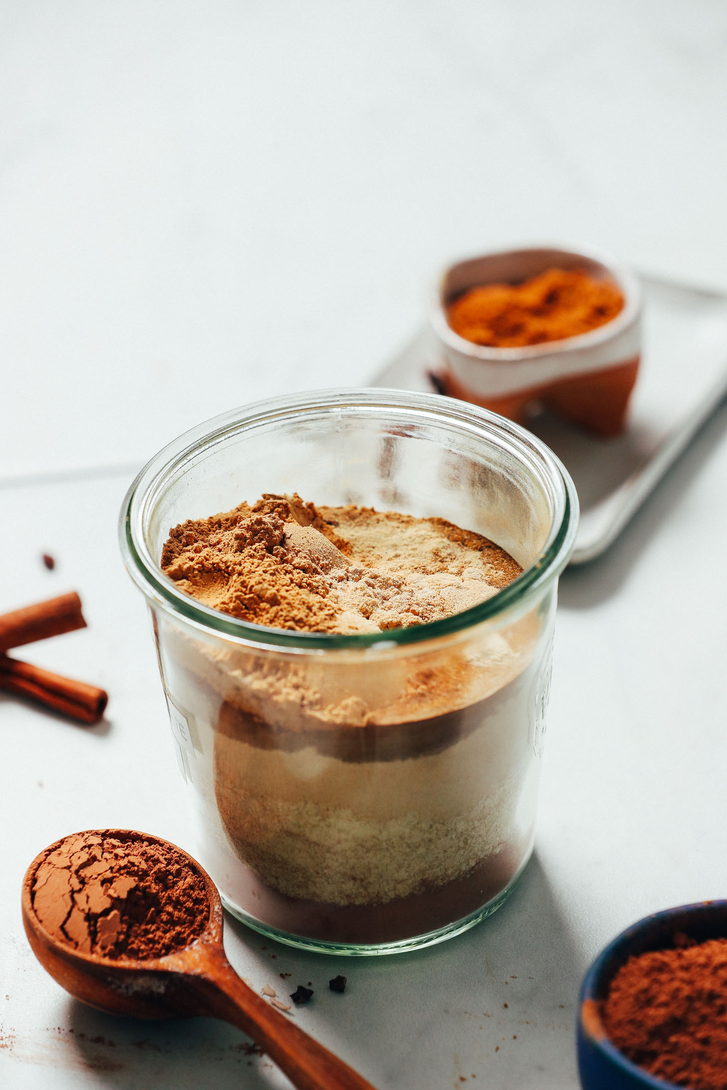 Spoonful and jar of our Easy Adaptogenic Hot Chocolate Mix