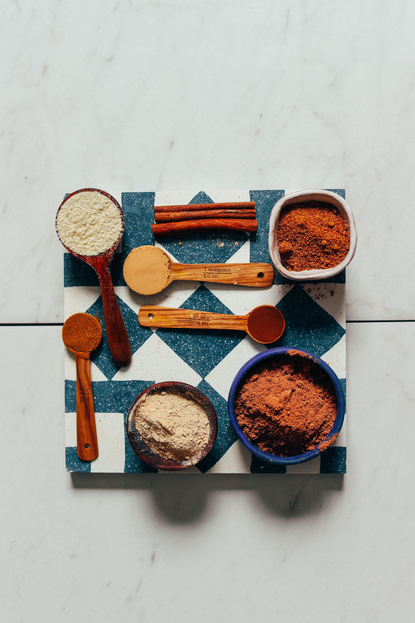 Cacao powder, maca, tocos, and other superfoods for making our Adaptogenic Hot Chocolate Mix recipe