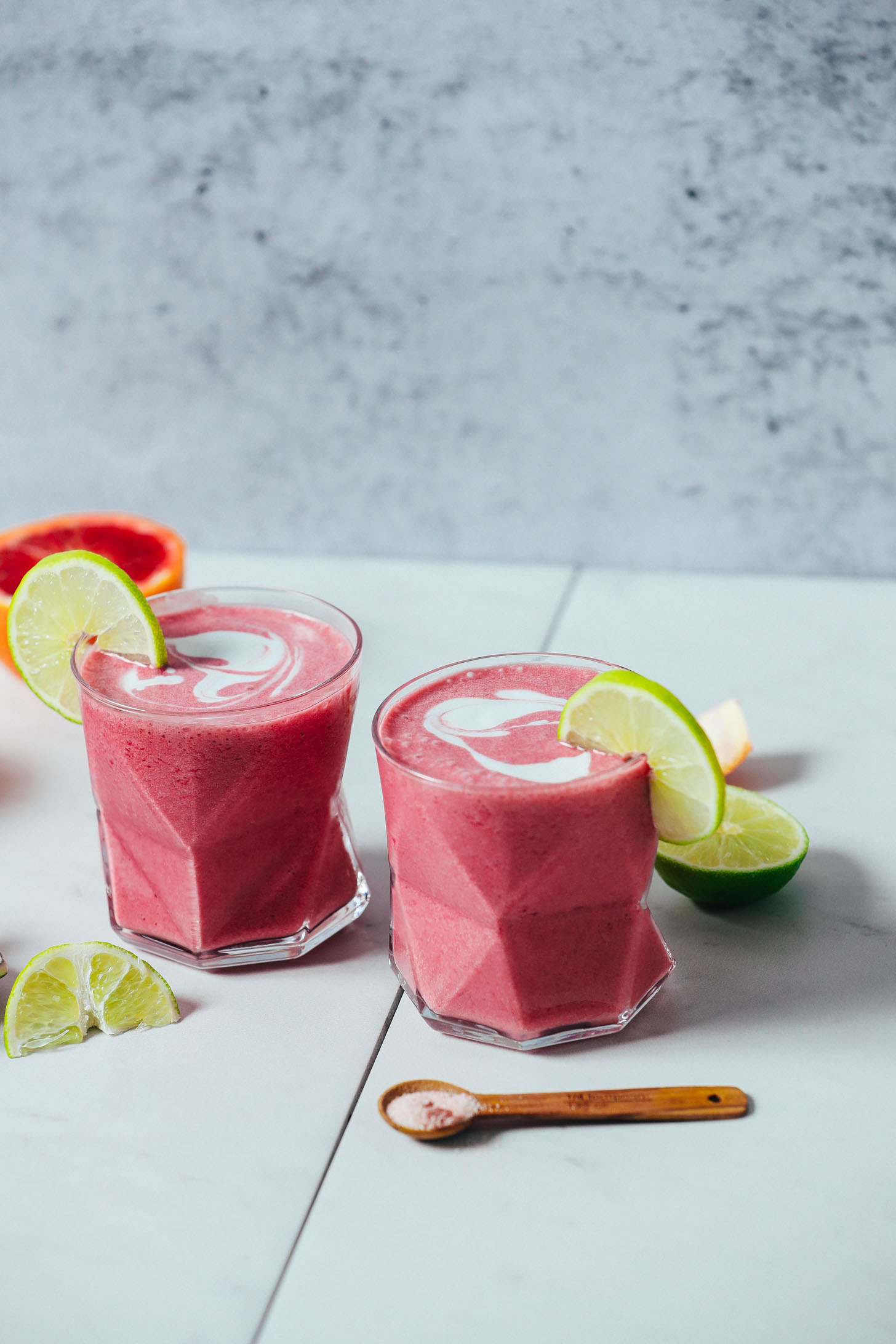 Two geometric glasses filled with our Orange Creamsicle Smoothie recipe
