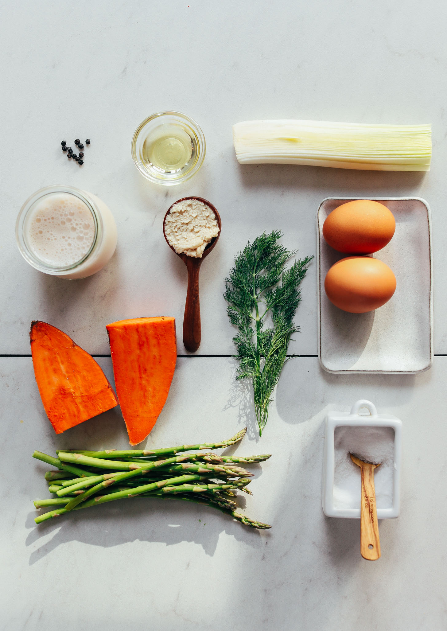 Asparagus, sweet potato, leek, dill, eggs, and other ingredients for making our Spring Frittata recipe