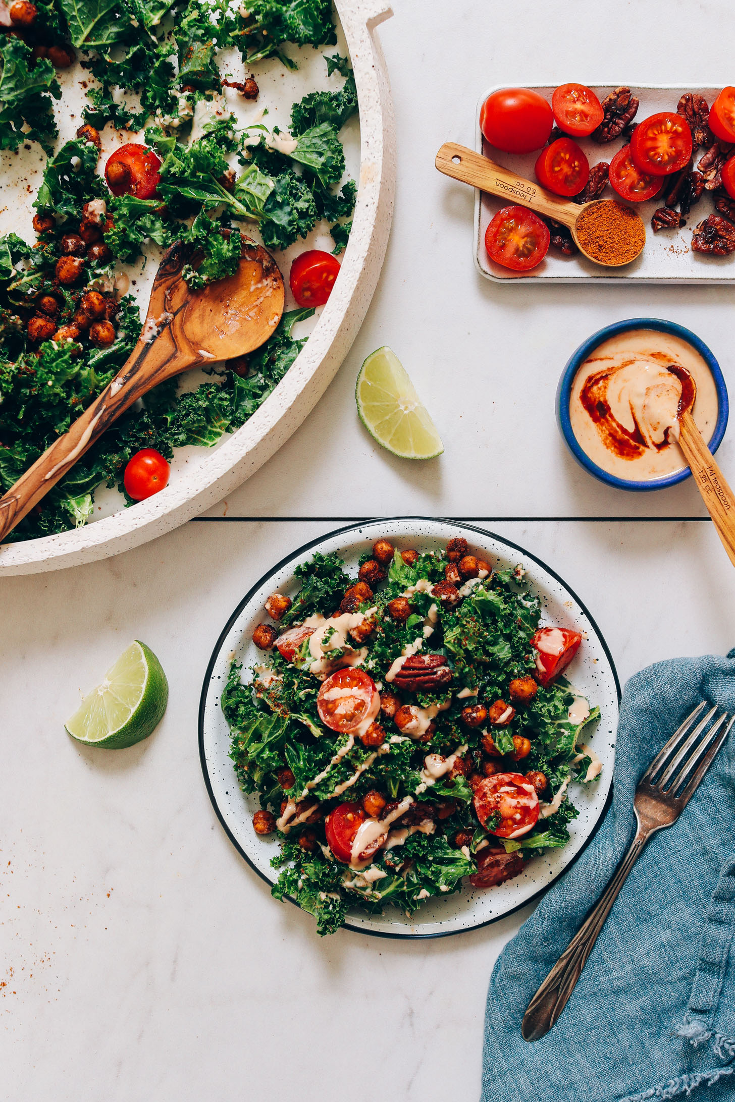 Plate and platter of Chickpea Chopped Kale Salad with Adobo Dressing