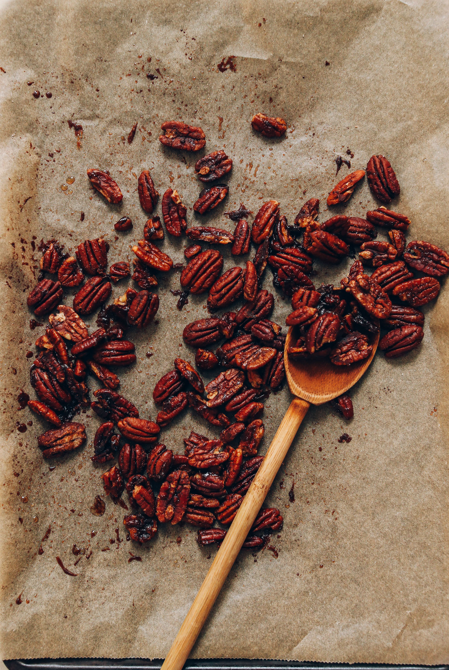 Parchment-lined baking sheet of Candied Pecans for adding to our Chickpea Chopped Kale Salad
