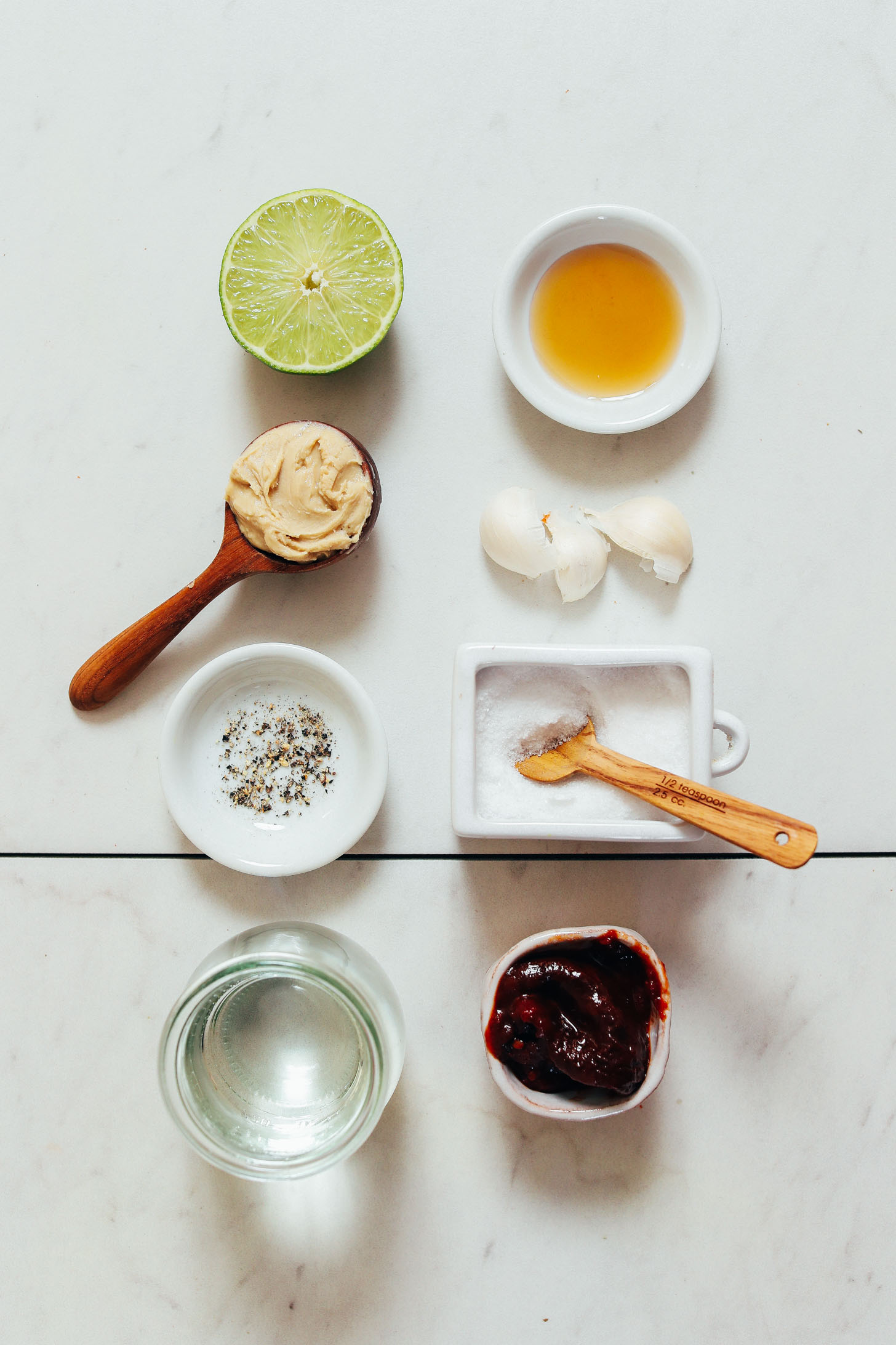 Lime, cashew butter, salt, pepper, adobo sauce, garlic, and maple syrup for making our Smoky Chipotle Dressing
