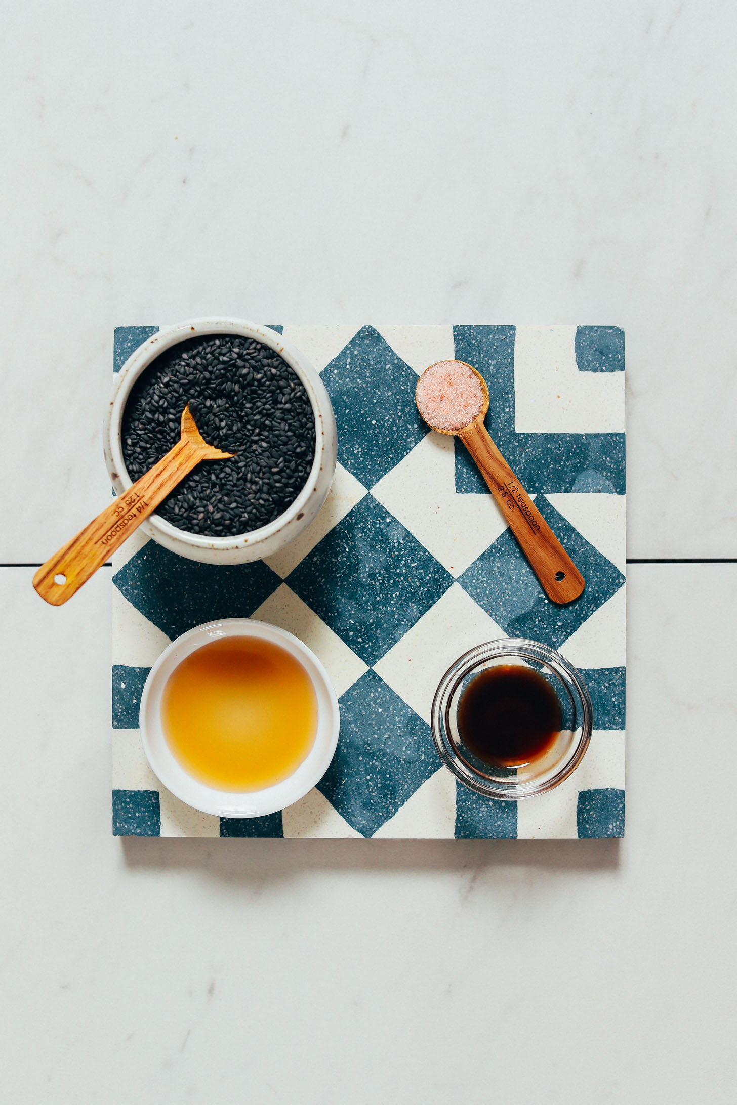 Black sesame seeds, sea salt, maple syrup, and vanilla for making our Creamy Black Sesame Milk