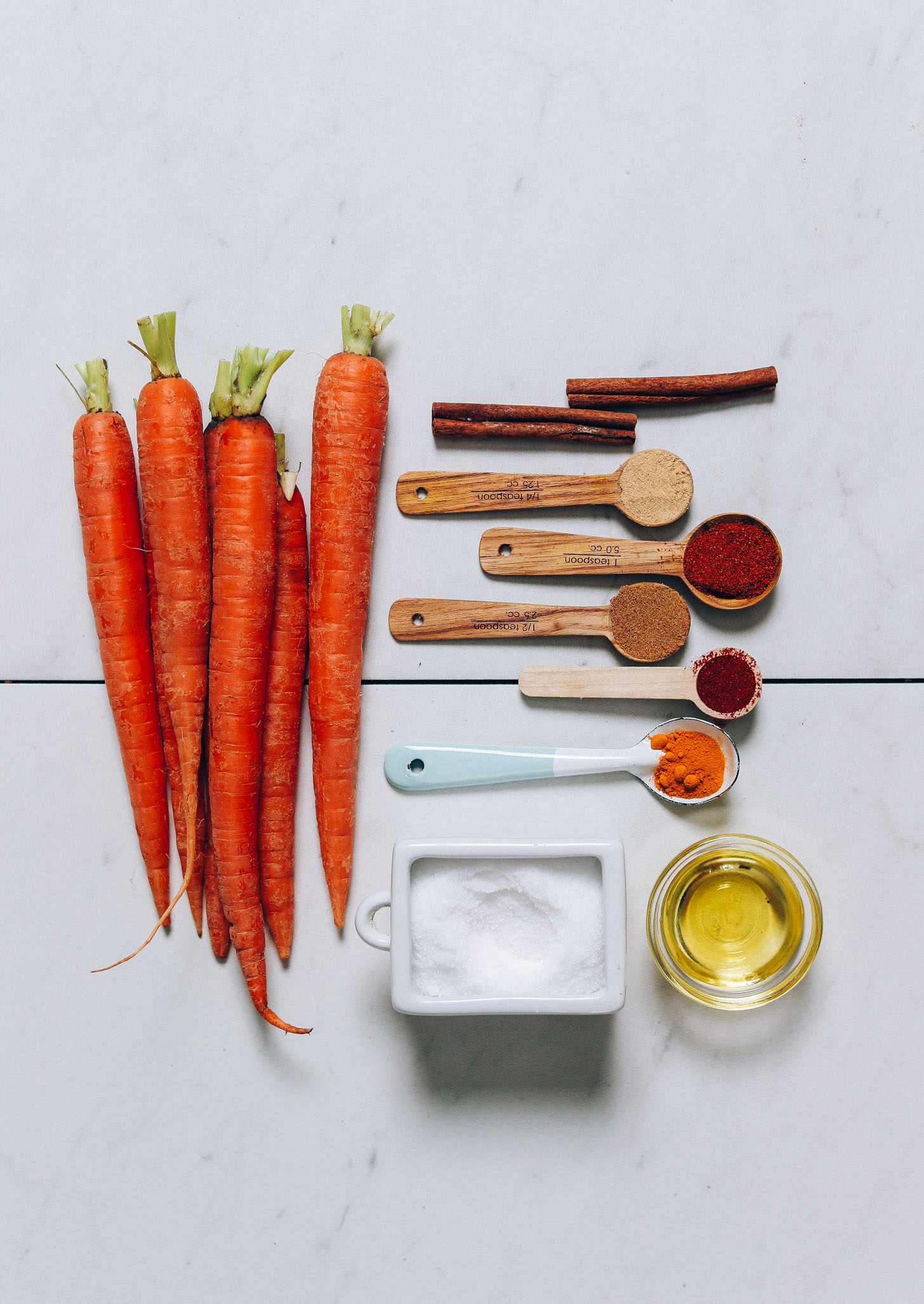 Carrots, cinnamon, ginger, smoked paprika, cumin, turmeric, salt, cayenne,  and avocado oil for making our Roasted Carrots recipe