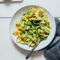 Fork resting in a plate of homemade Gluten-Free Pasta made with almond flour and eggs