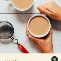 Holding the handle of a mug of our Easy Masala Chai Tea