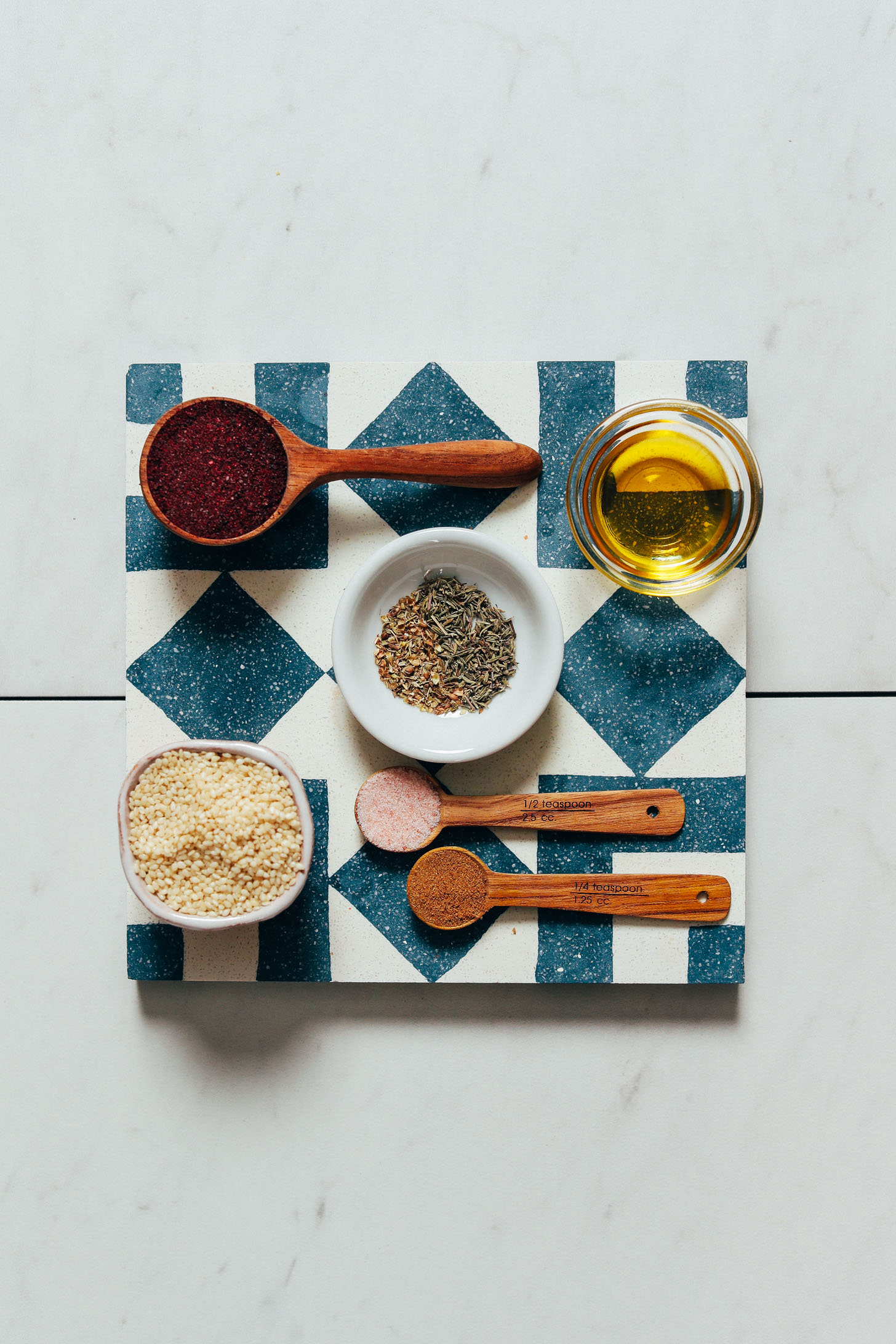 Blue and white tile filled with ingredients for making our za'atar recipe