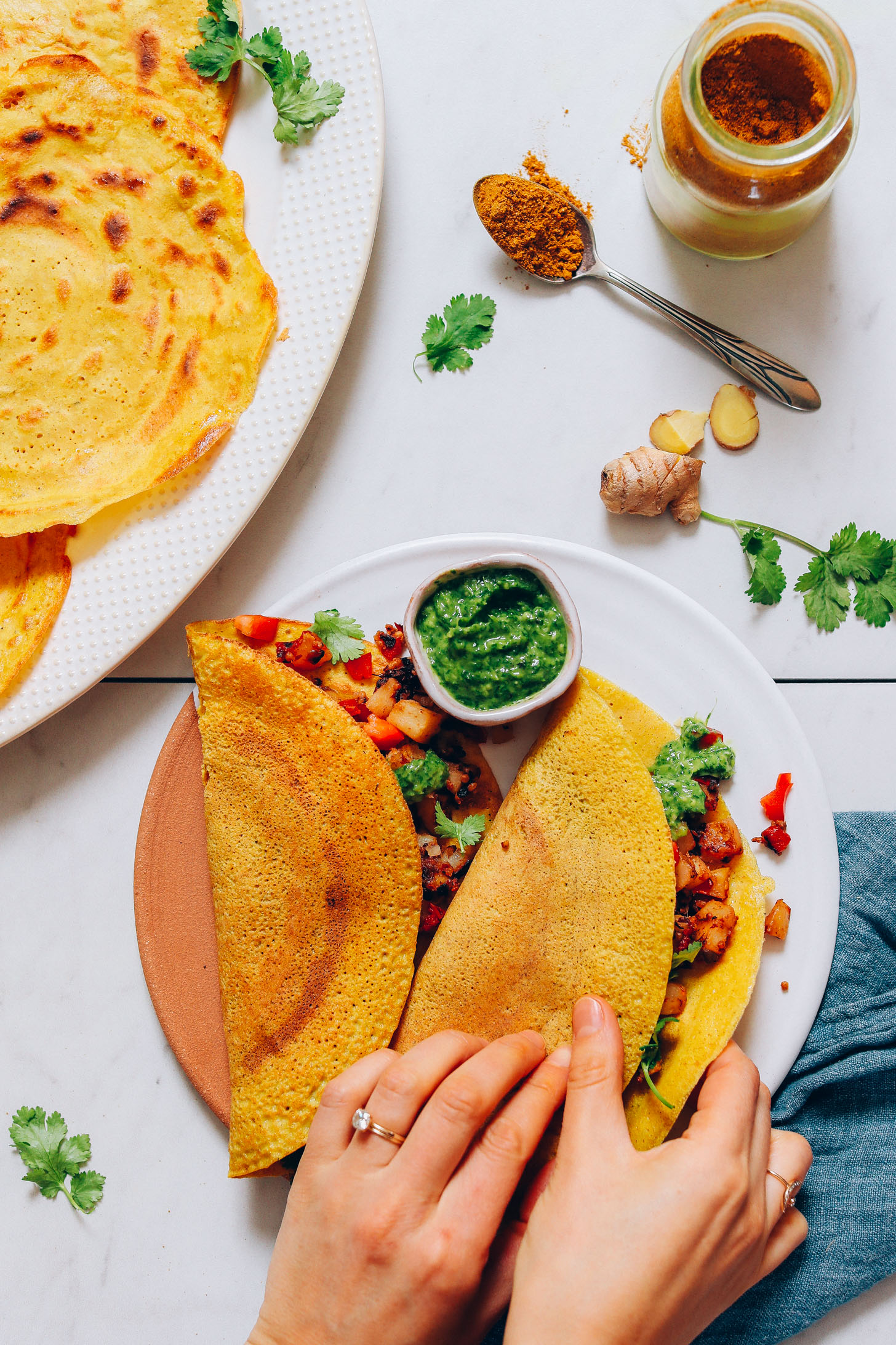 Picking up a Moong Dal Dosa filled with Potato Sabzi and green chutney