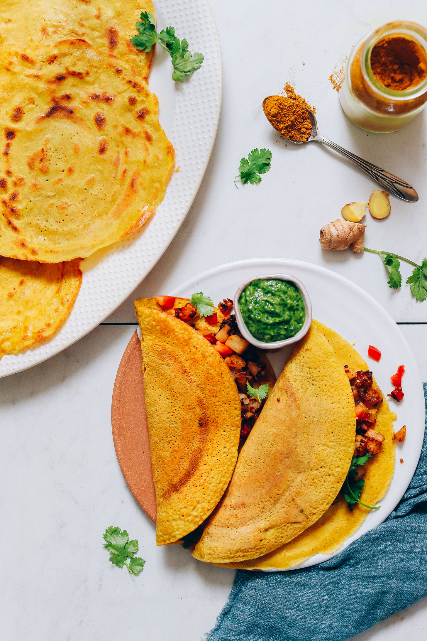 Platter and plate of moong dal dosas