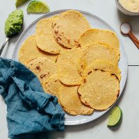 Platter of homemade tortillas for our tutorial on How to Make Corn Tortillas