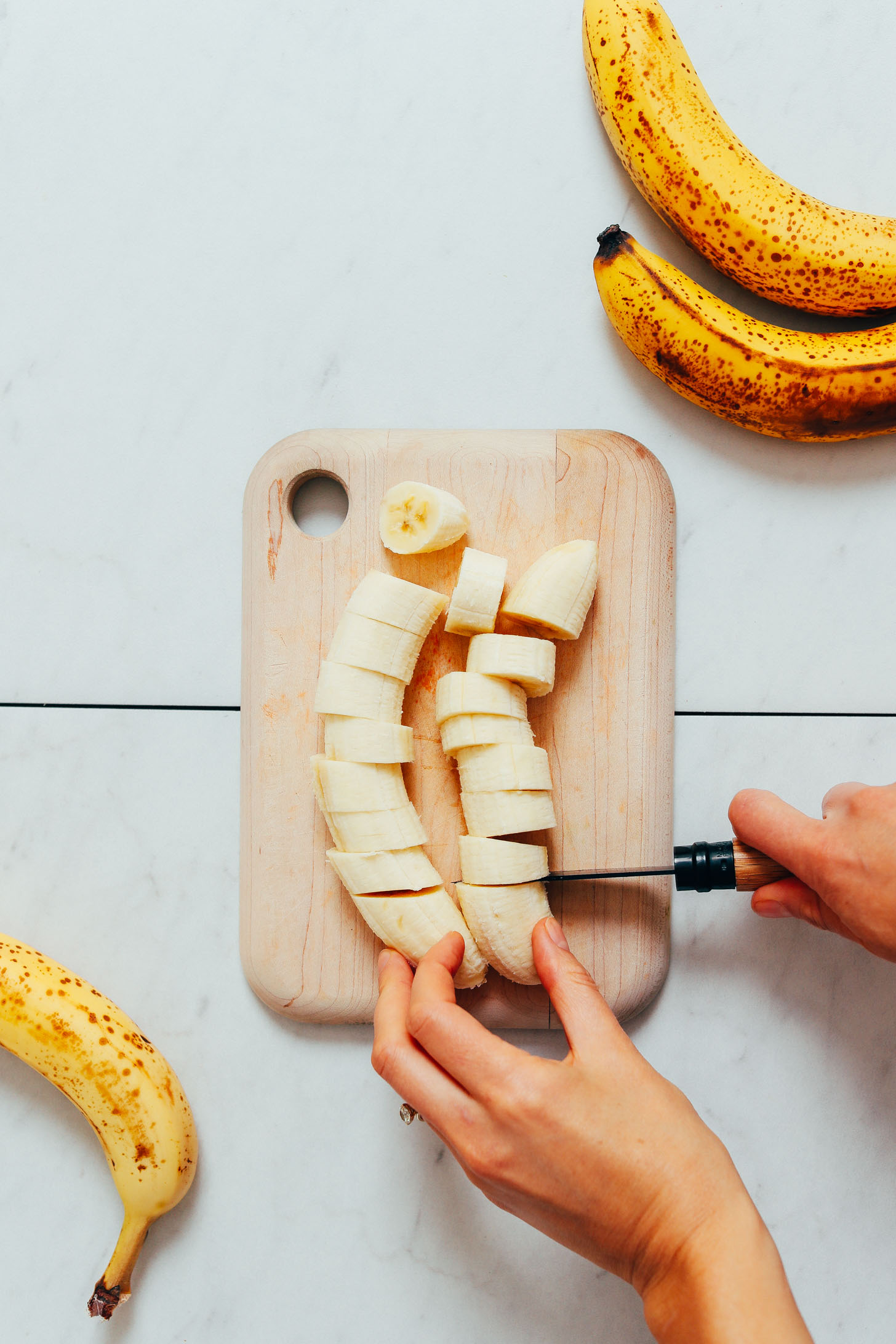 Chopping bananas to make Banana Ice Cream