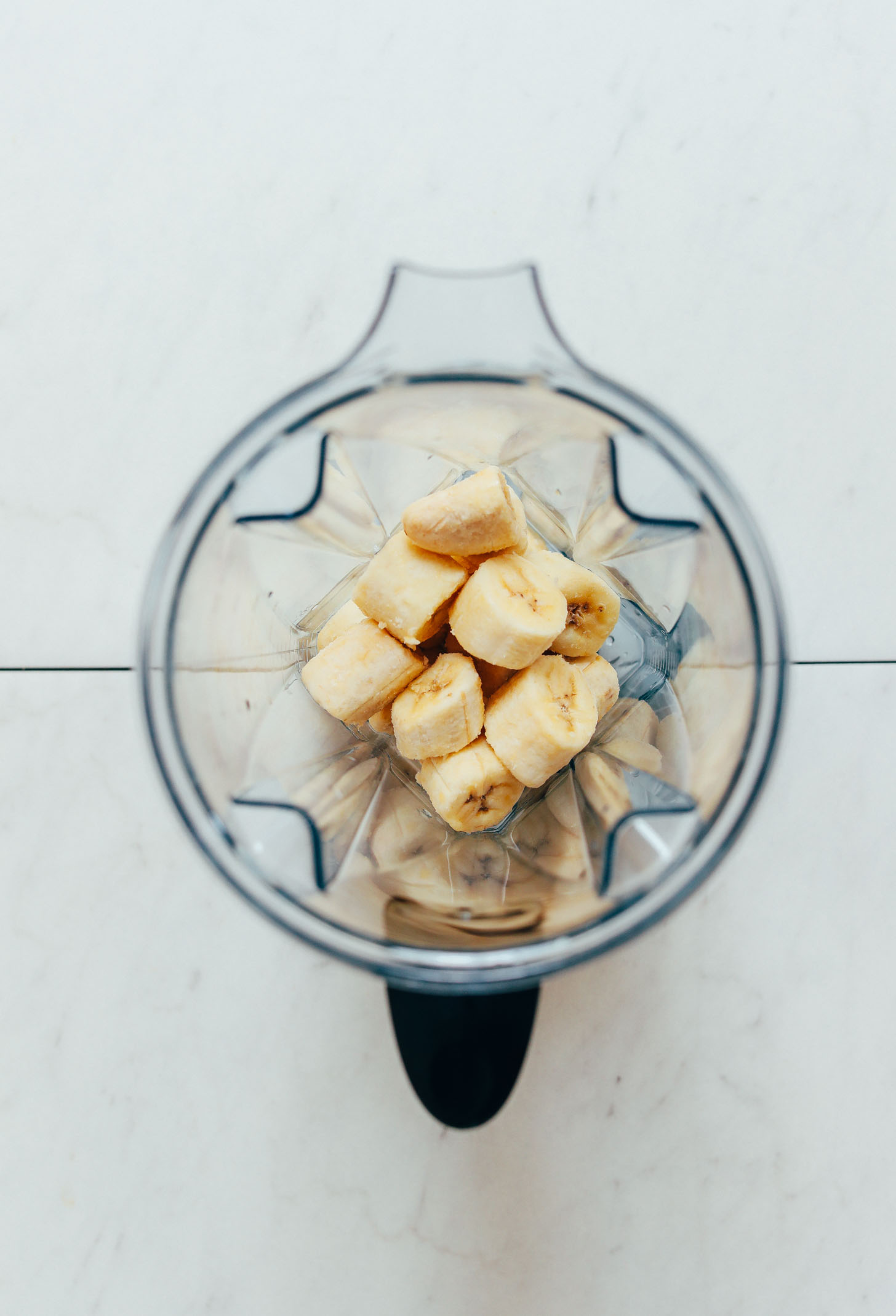 Frozen banana chunks in a blender for making Banana Ice Cream