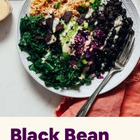 Black Bean Buddha Bowl topped with tahini sauce