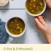 Holding onto a mug of our Nourishing Bone Broth Tonic recipe