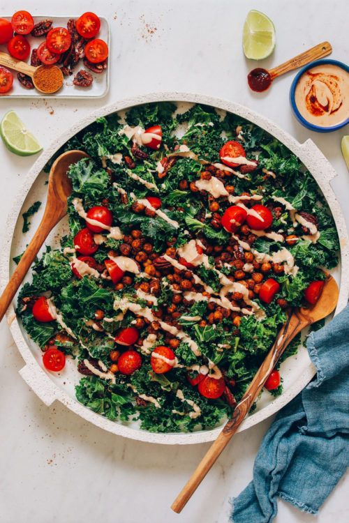 Large platter of our Chickpea Chopped Kale Salad drizzled with Chipotle Dressing