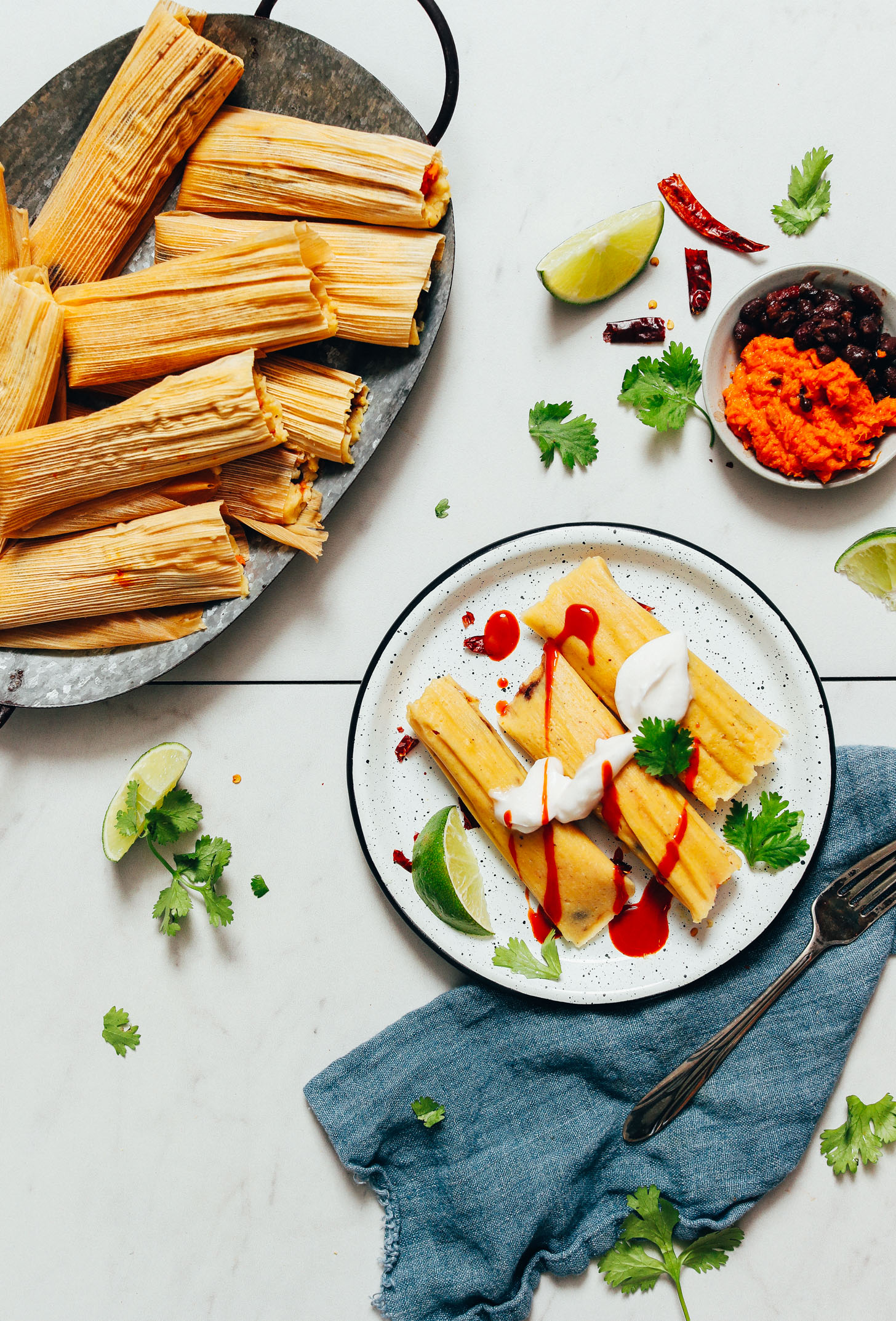 Tray and plate of sweet potato black bean tamales