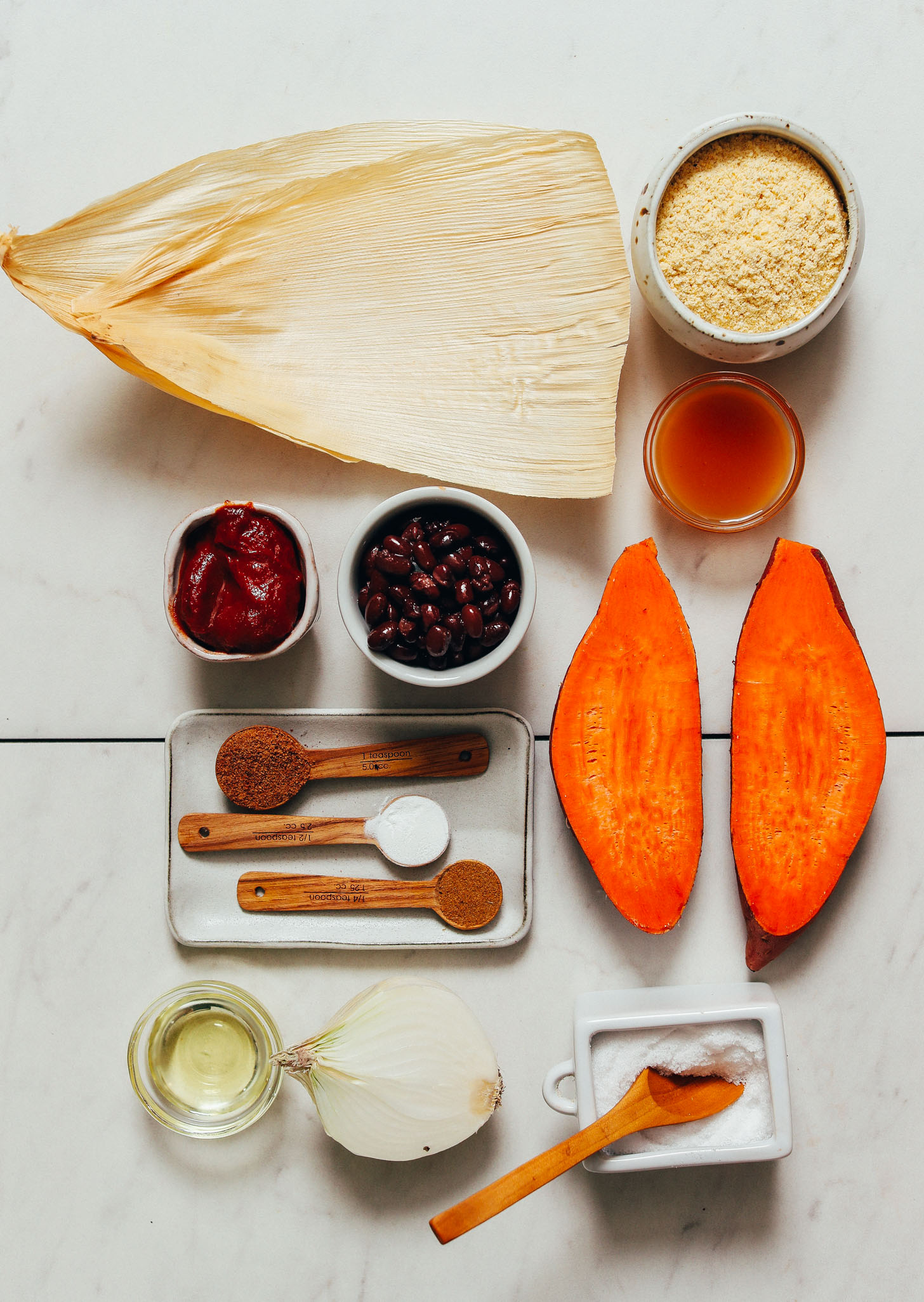 Corn husks, masa harina, vegetable broth, sweet potatoes, black beans, avocado oil, spices, and salt