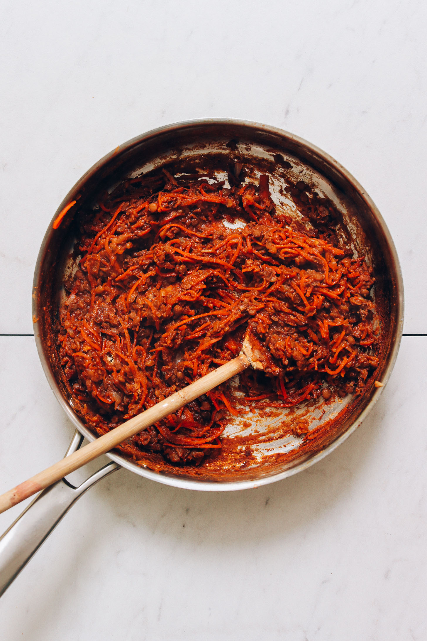 Skillet of vegan taco meat made with lentils and carrots