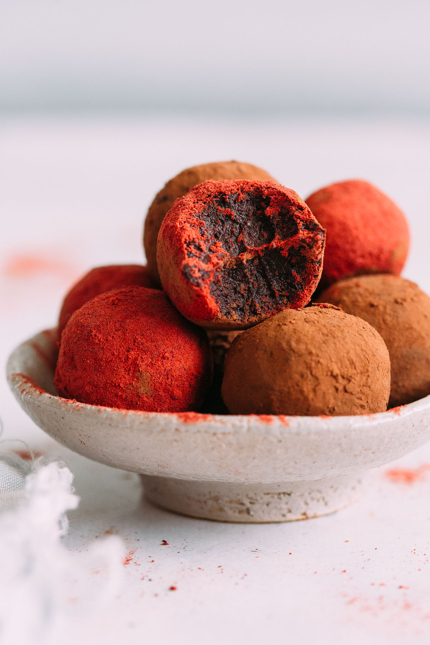 Close up shot of a bowl of no bake red velvet cake balls