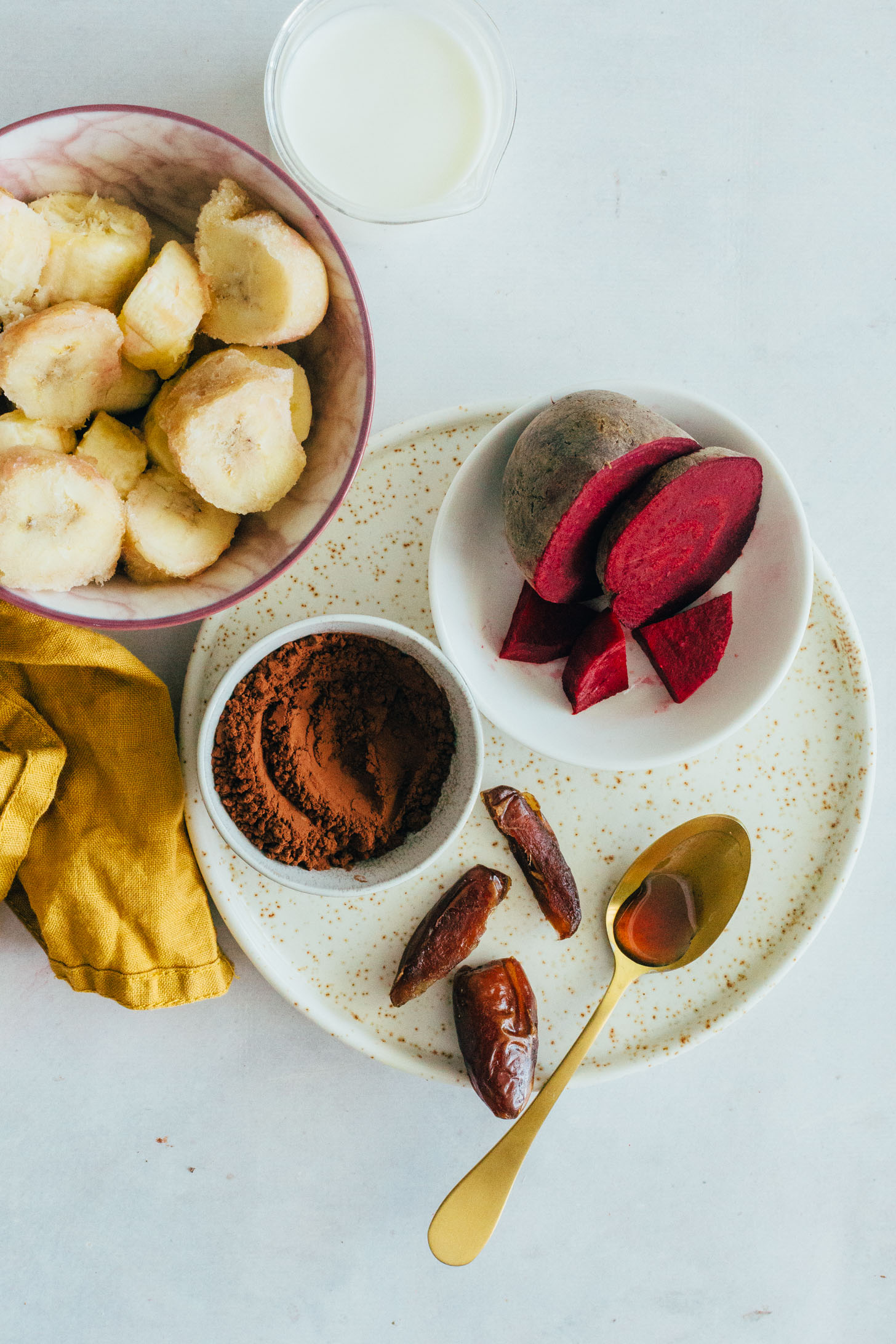 Frozen banana chunks, dairy-free milk, cacao powder, dates, and beets