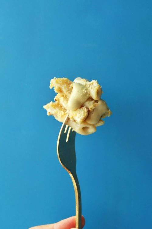 Fork holding up a bite of vegan gluten free mac n cheese