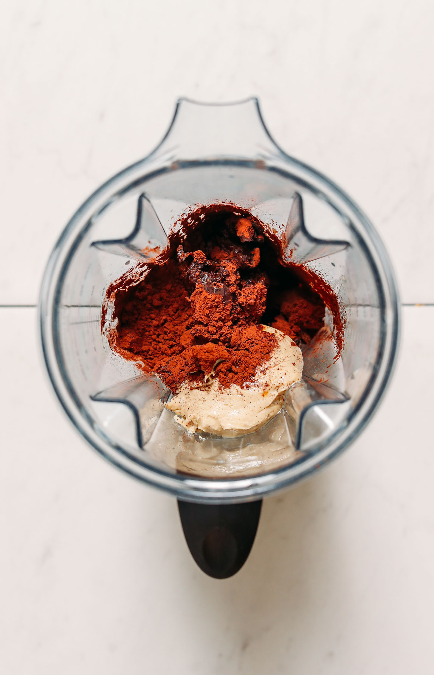 Dates, cacao powder, cashew butter, vanilla, and sea salt in a blender
