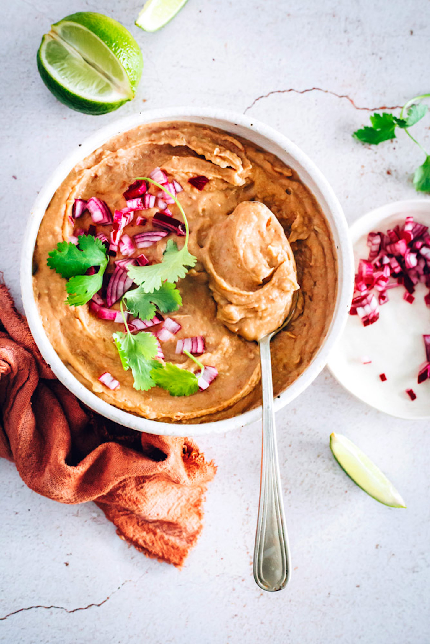 Top down shot of a bowl of Creamy Vegan Refried Beans