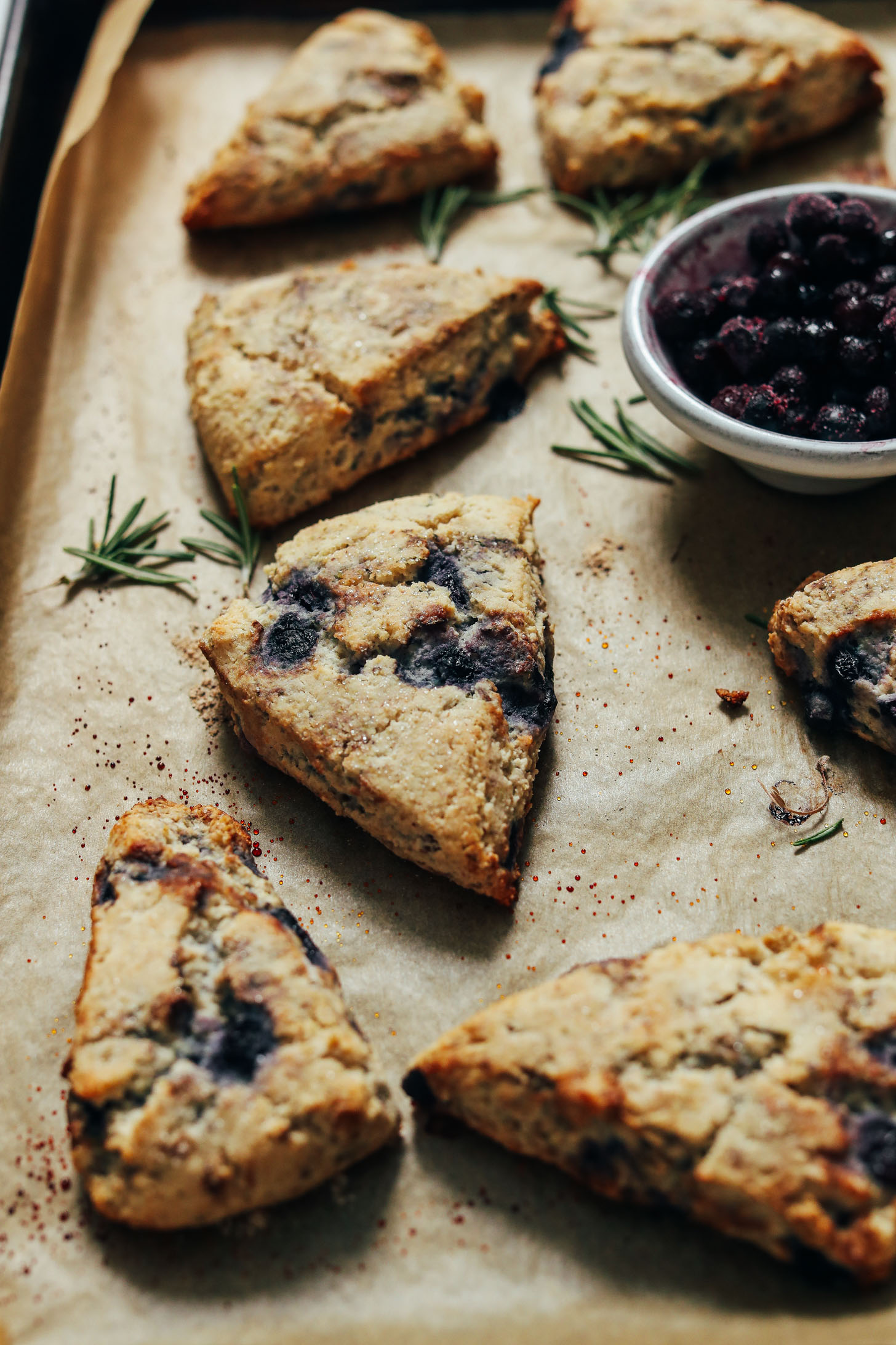 Parchment-lined baking sheet of flaky Gluten Free Scones