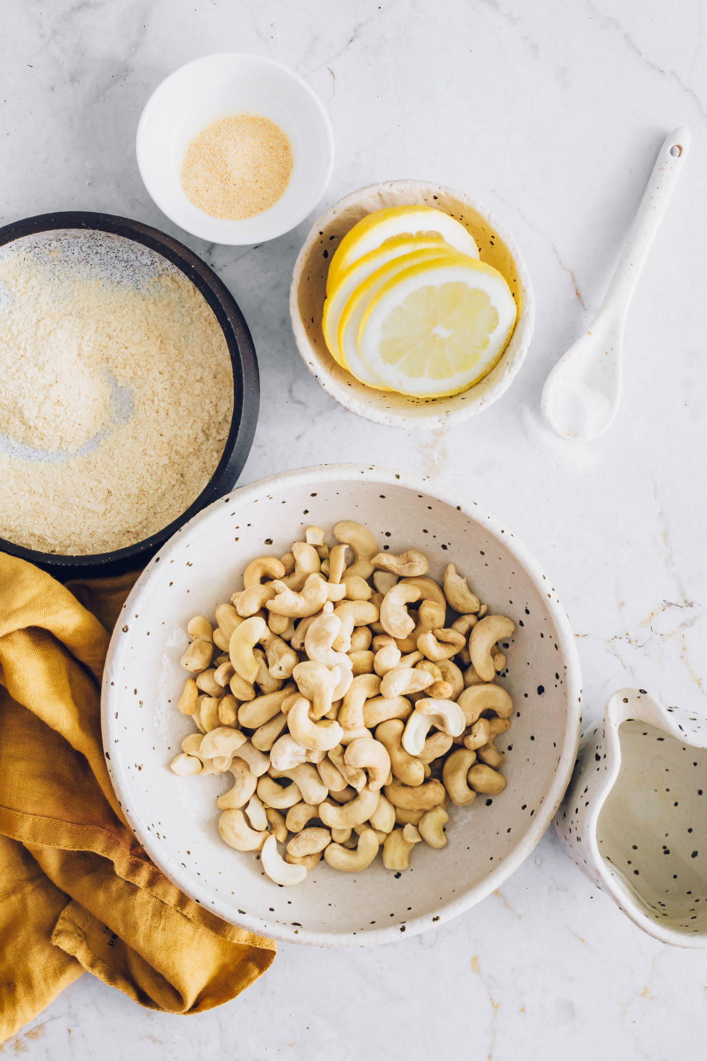 Cashews, nutritional yeast, lemon slices, garlic powder, salt, and water
