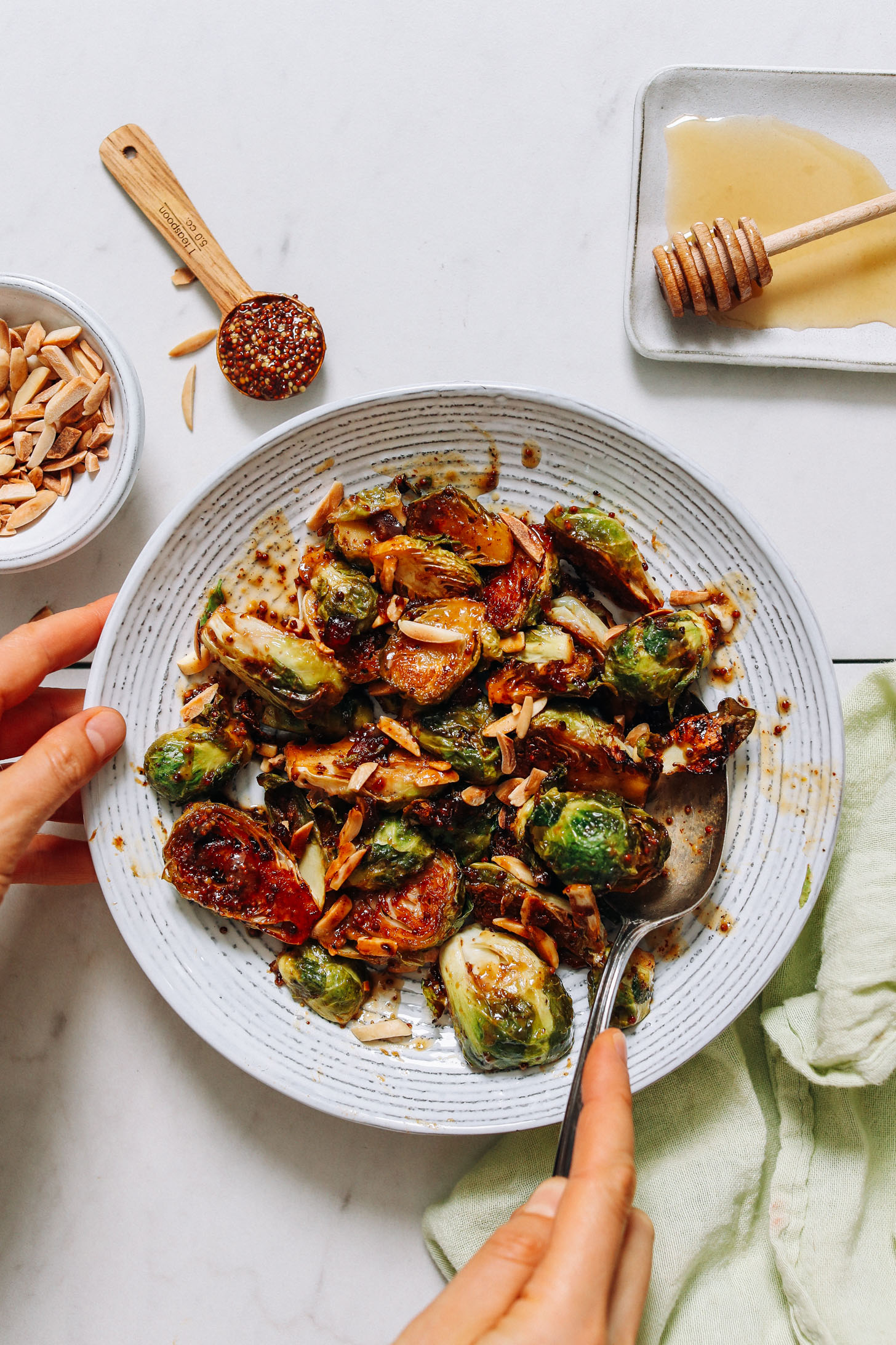 Bowl of Roasted Brussels with honey mustard glaze and toasted almonds