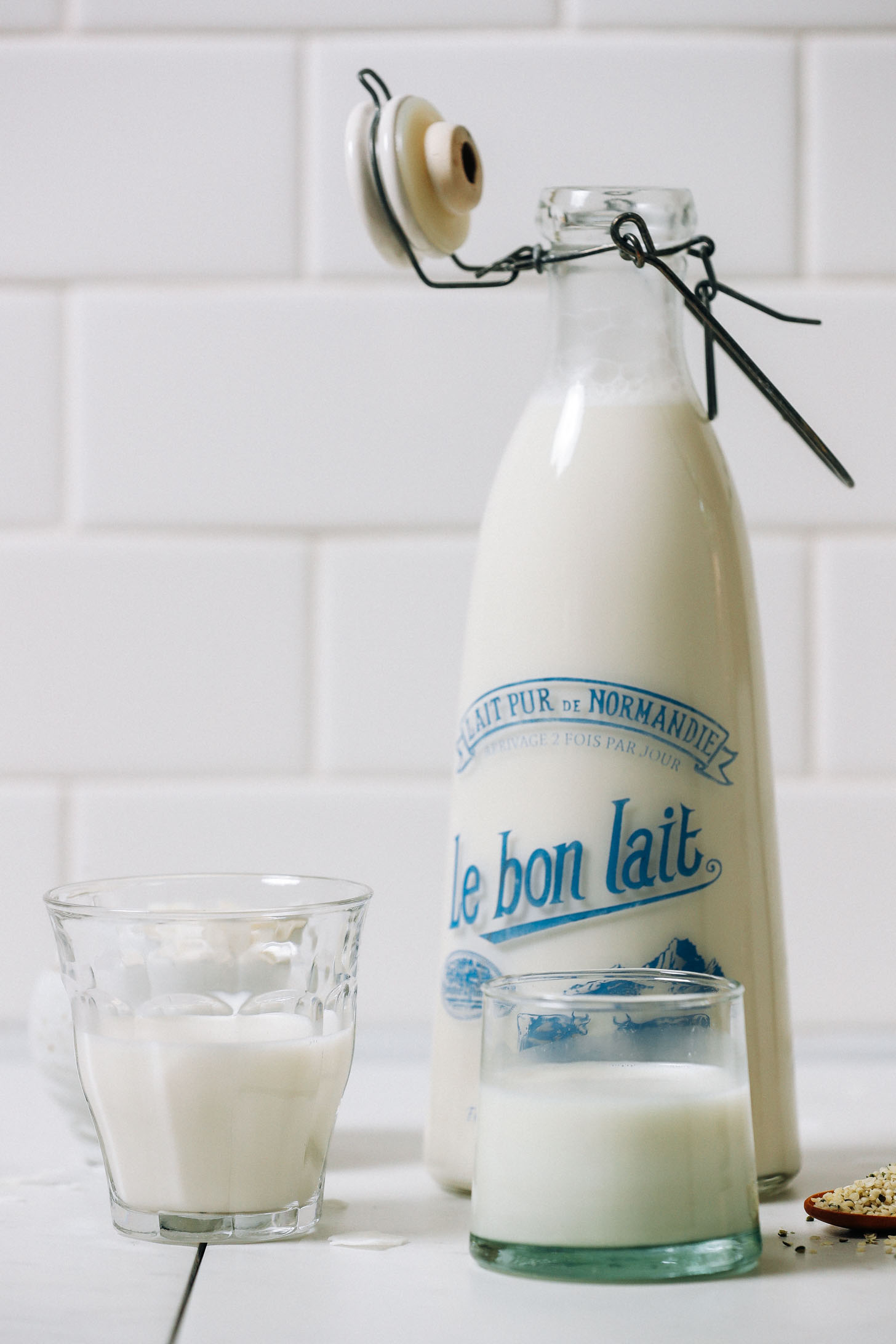 Jug and glasses of creamy homemade Coconut Hemp Milk