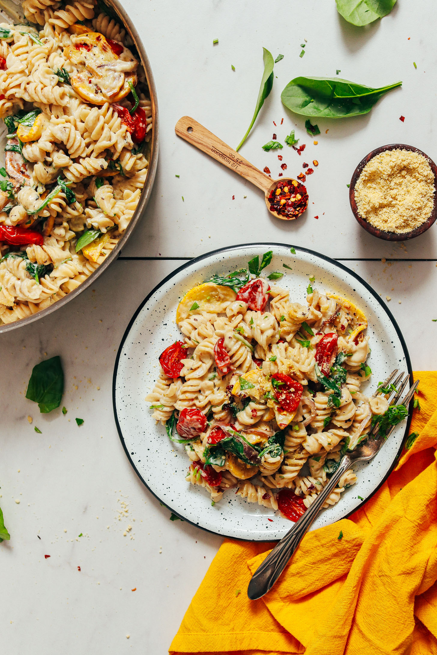Top down shot of a plate of gluten-free pasta with slow roasted tomatoes and vegan pasta sauce