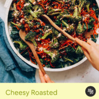 Using wooden salad spoons to pick up a bite of Chickpea Kale Salad