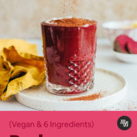Sprinkling cacao powder onto a Red Velvet Cake Smoothie