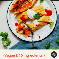 Fork cutting into a vegan tamale made with black beans and sweet potato