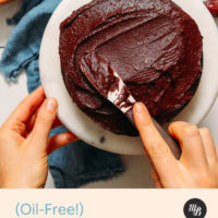 Spreading Vegan Chocolate Frosting onto a cake