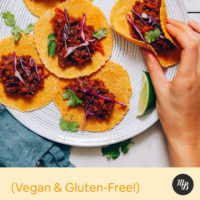 Picking up a Smoky Lentil Vegan Taco from a plate