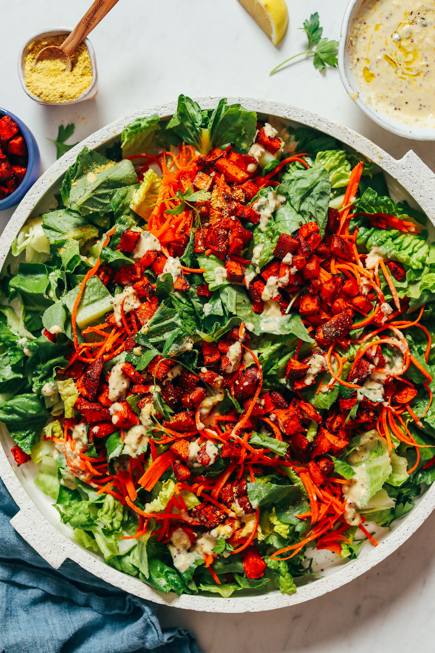 Large platter of Vegan Caesar Salad topped with Sweet Potato Croutons
