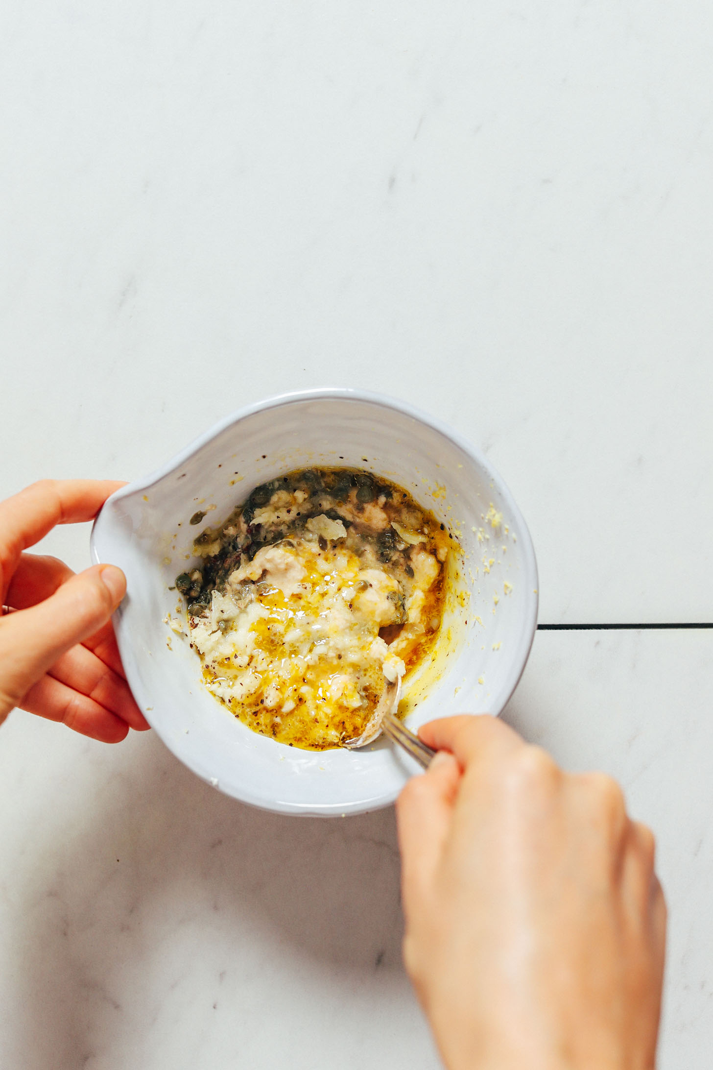 Mixing ingredients for Vegan Caesar Salad dressing