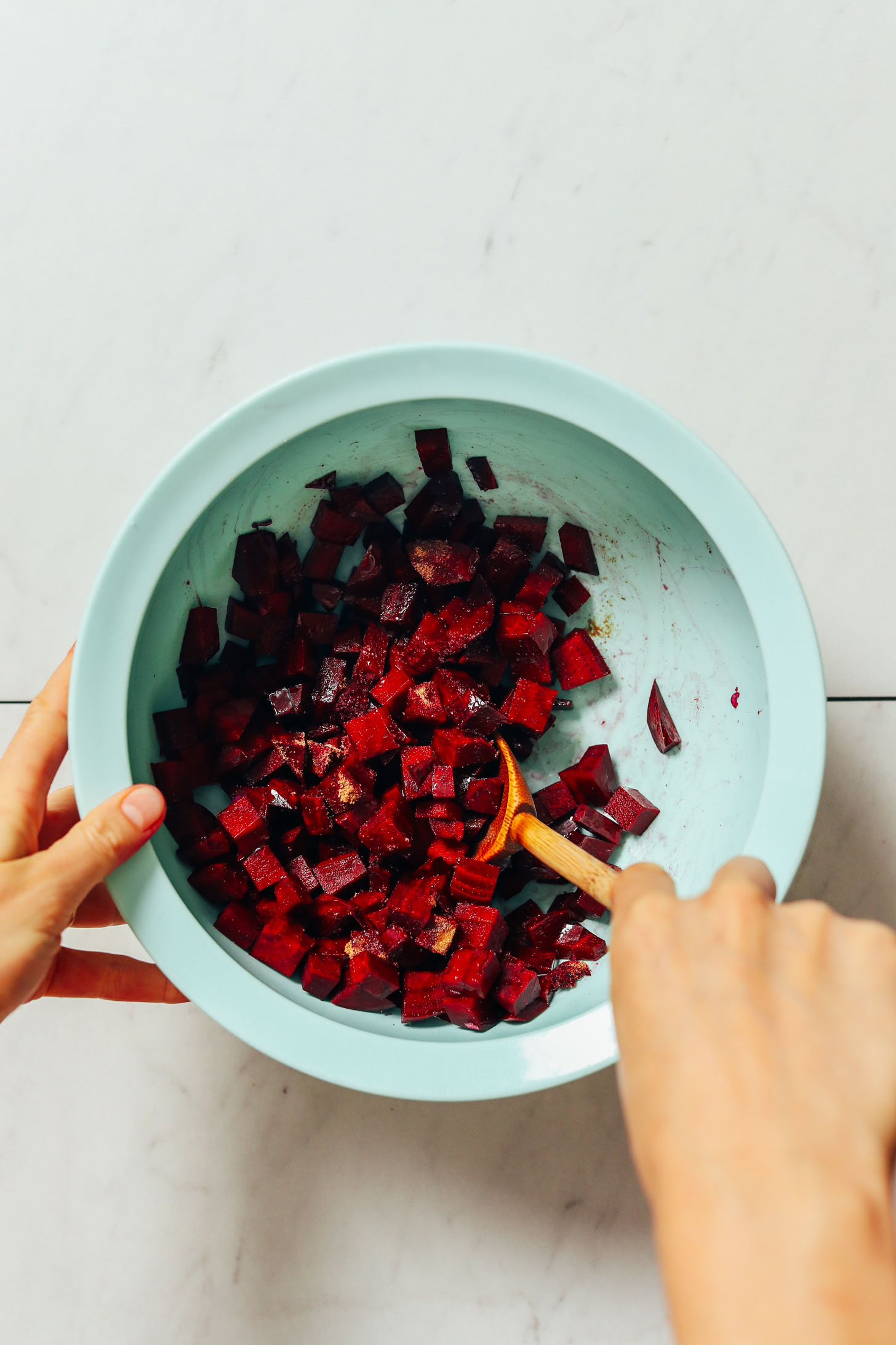 Bowl of cubed raw beets tossed in spices