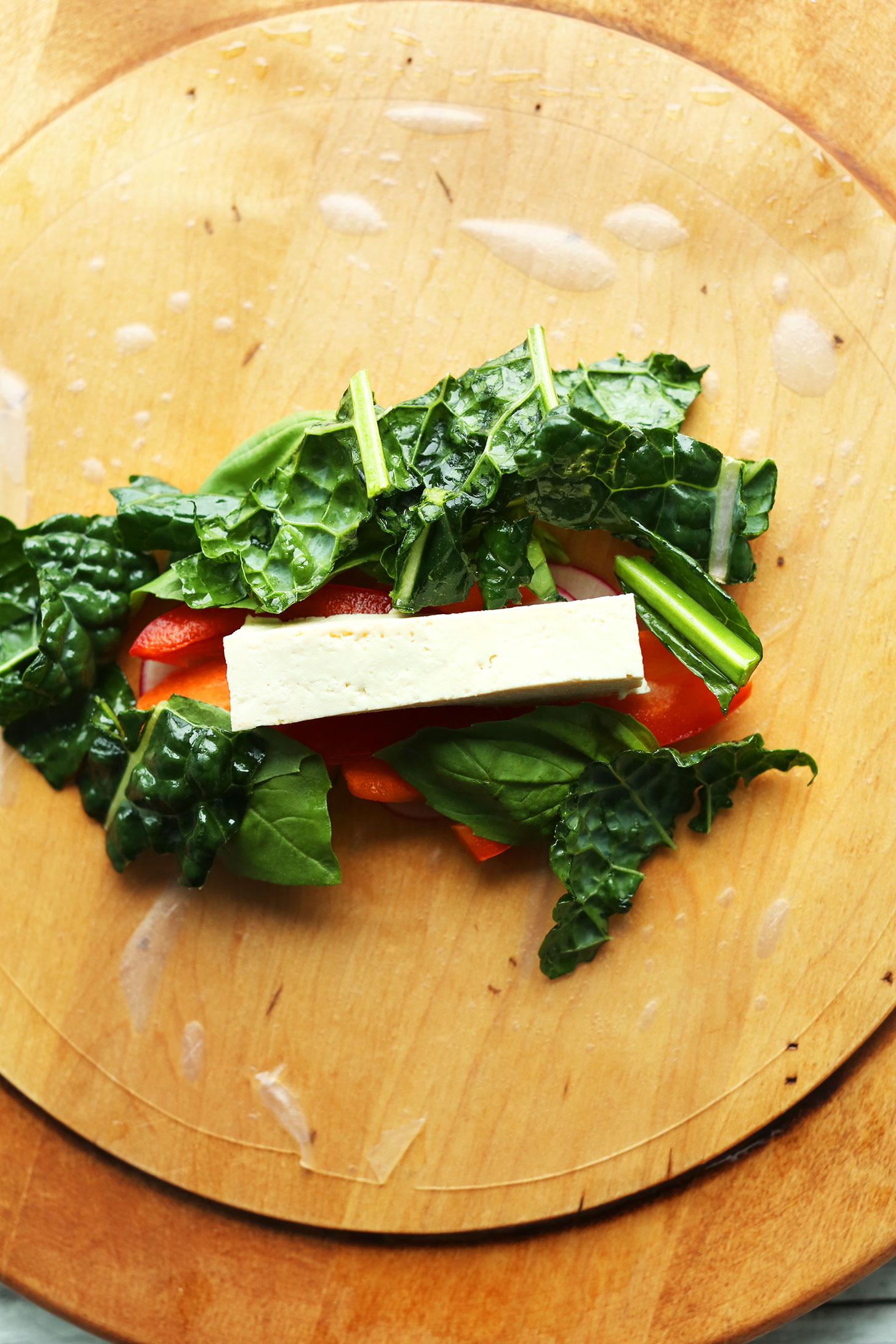 Rolling veggies and tofu in a spring roll paper