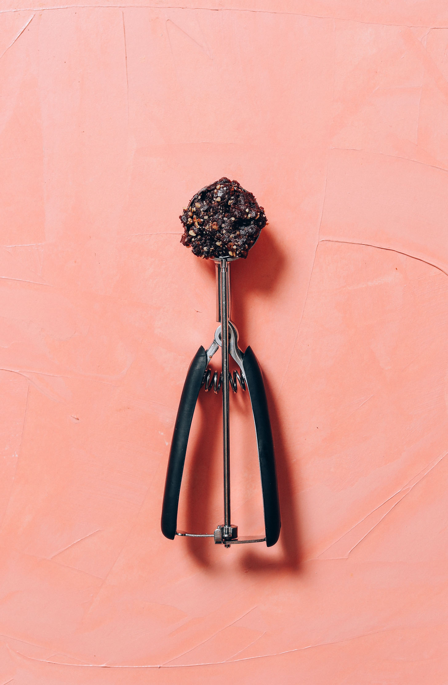 Cookie scoop of batter for No Bake Brownie Bites