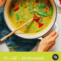 Holding a pot of Thai Green Curry made with snow peas and bell pepper