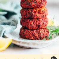 Stack of beet falafel topped with dairy-free yogurt and fresh dill