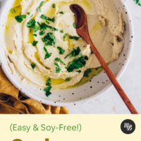 Bowl of vegan cashew ricotta topped with fresh parsley